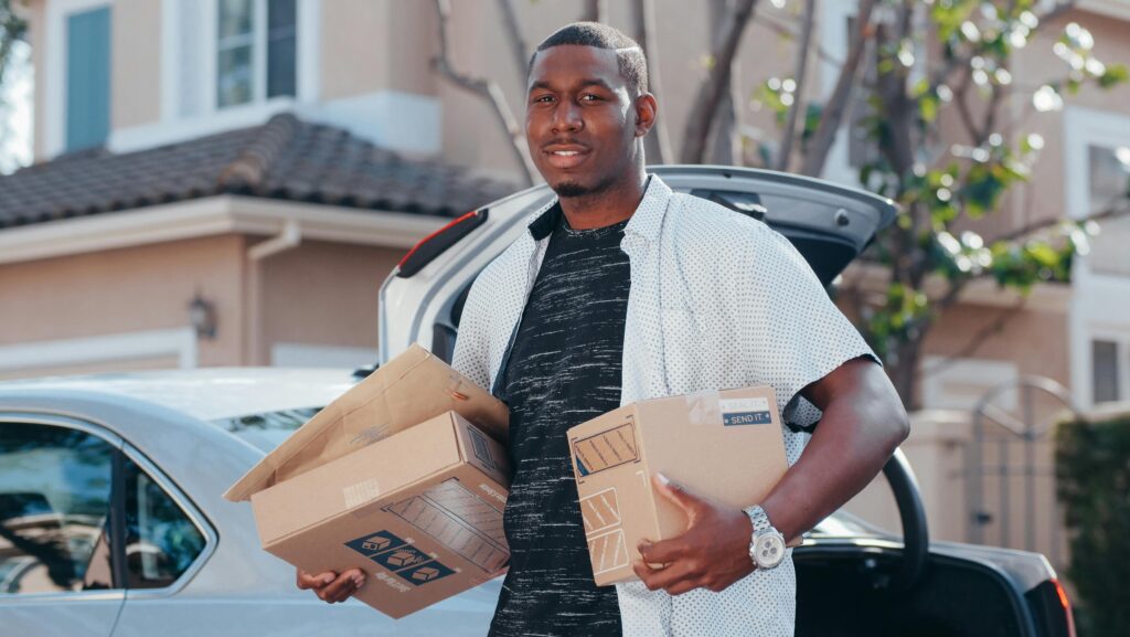 Anyware delivery agent holding two packages to be delivered